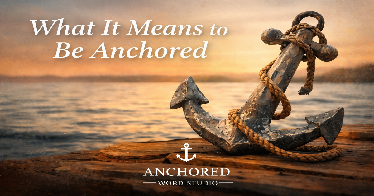 Weathered anchor resting on a dock at sunset with calm water in the background